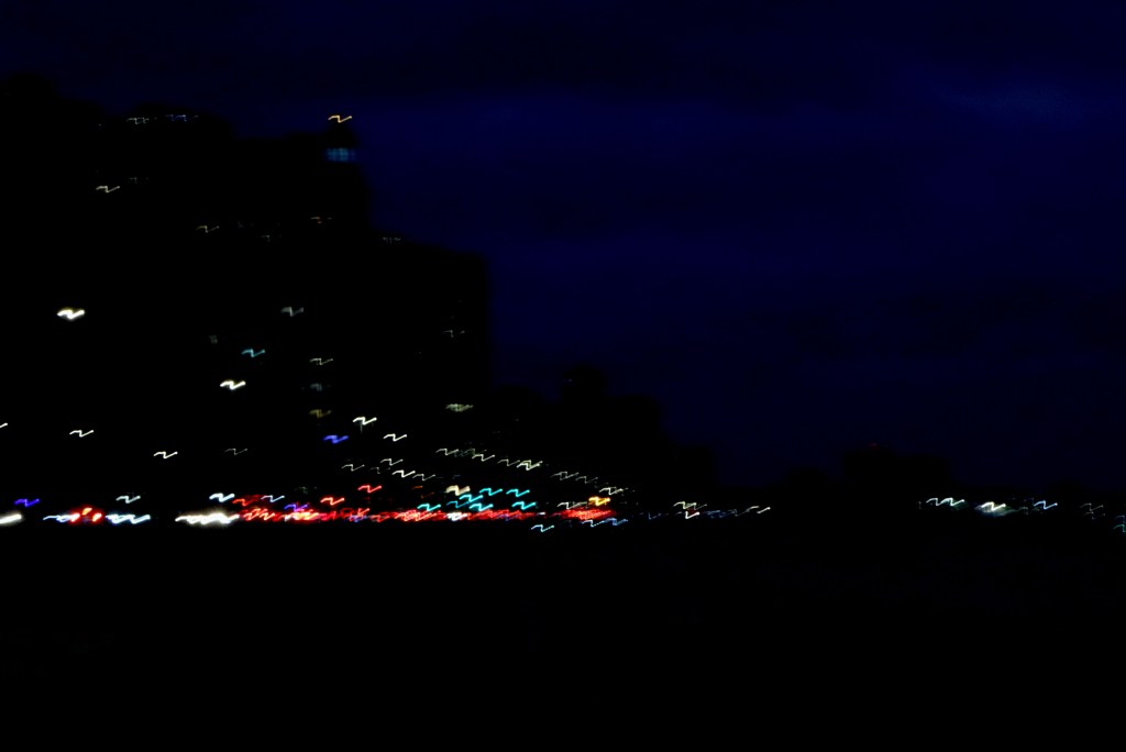 dark night scene with blurry lights